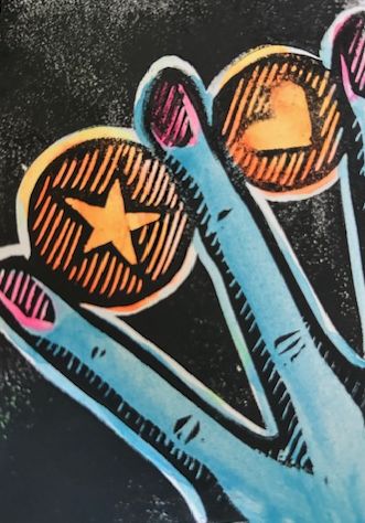 A hand holding two coins between its fingers.