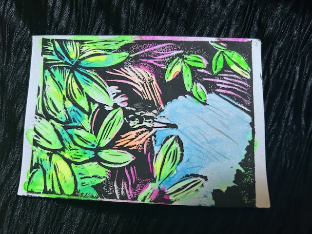 The Fool, a small figure climbing on the edge of an enormous nest.