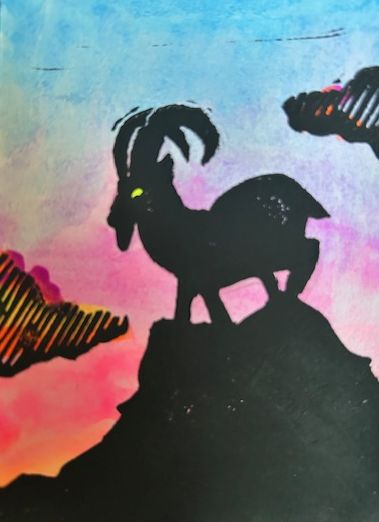 The Hermit, a mountain goat silhouetted on the mountaintop.